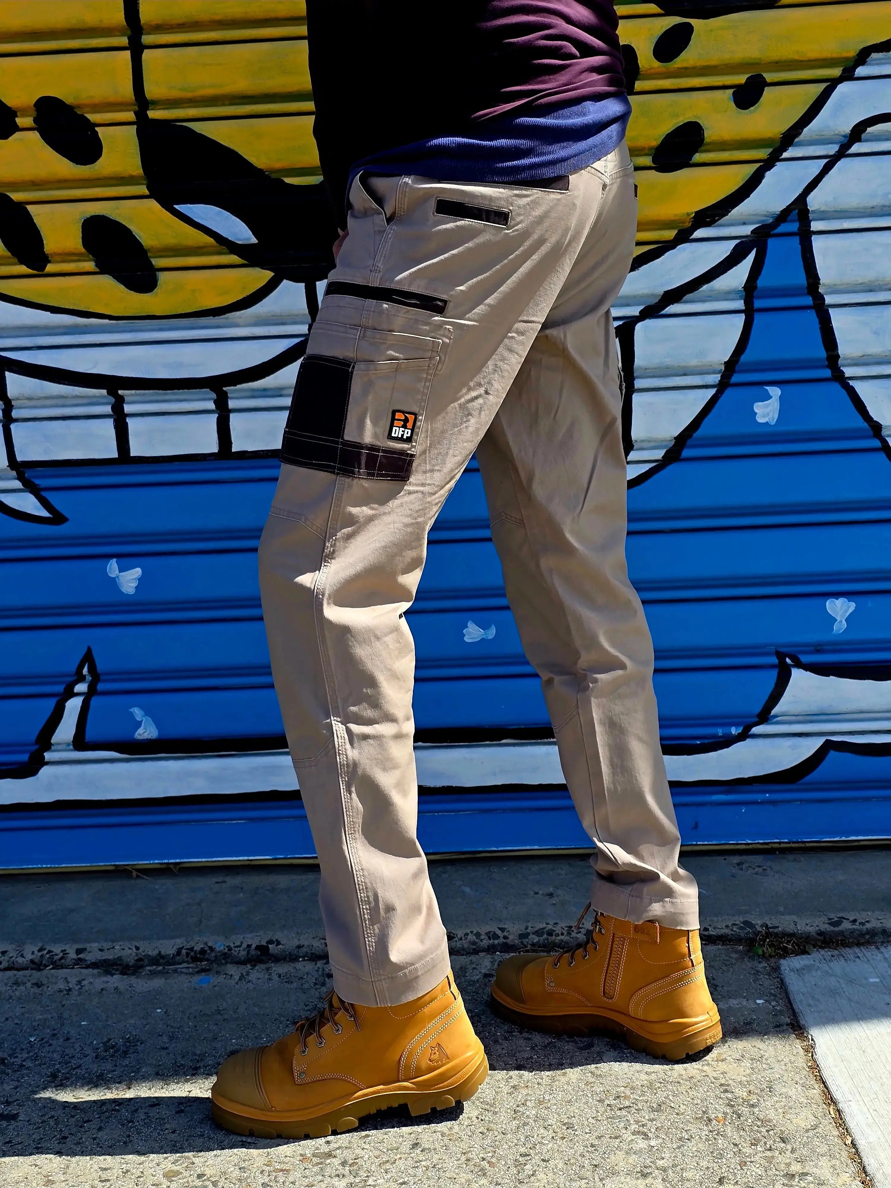 Australian tradie wearing durable DFP stretch canvas work pants on site