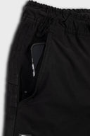 DFP PS2 work shorts showing side pocket and enclosed mobile pocket in black.