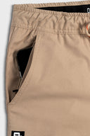 DFP PS2 work shorts showing side  pocket and enclosed mobile pocket in khaki.